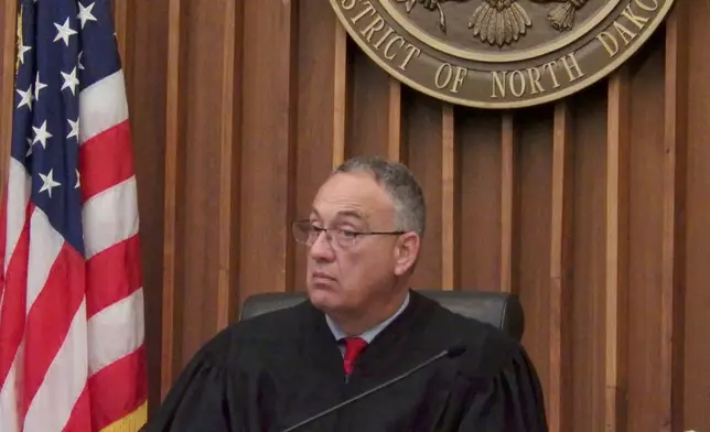 Chief Judge Peter Welte listens during a naturalization ceremony on Friday, June 27, 2025, at the William L. Guy Federal Building in Bismarck, N.D. (AP Photo/Jack Dura)