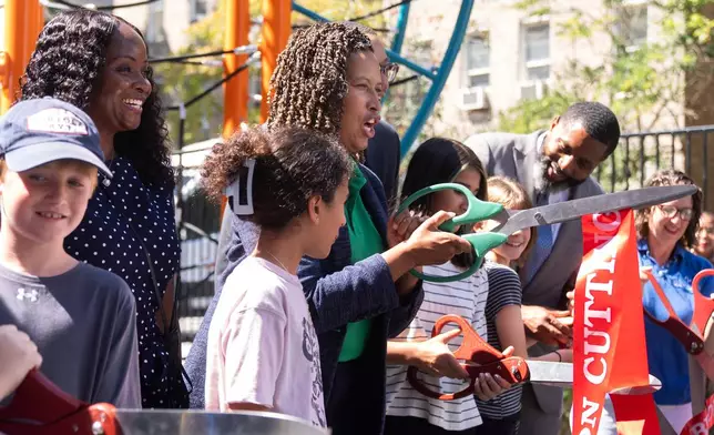 District of Columbia Mayor Muriel Bowser, center, attends a celebration of the first day of school at Oyster-Adams Bilingual School Monday, Aug. 25, 2025, in Washington. (AP Photo/Manuel Balce Ceneta)