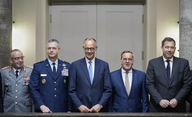 From left to right, German Federal Armed Forces (Bundeswehr) Chief of Defence Carsten Breuer, NATO SACEUR General Alexus Grynkewich, German Chancellor Friedrich Merz, German Defense Minister Boris Pistorius, and Finance Minister Lars Klingbeil pose for a group picture prior to the Cabinet meeting at the Defense Ministry in Berlin, Germany, Wednesday, Aug. 27, 2025. (AP Photo/Ebrahim Noroozi)