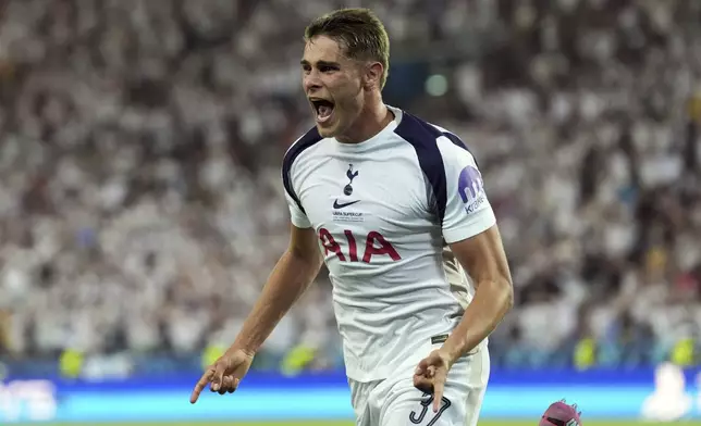 Tottenham's Micky van de Ven celebrates scoring side's first goal during the UEFA Super Cup soccer match between Paris Saint-Germain and Tottenham Hotspur in Udine, Italy, Wednesday, Aug. 13, 2025. (Massimo Paolone/LaPresse via AP)
