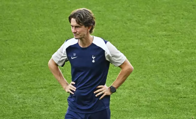 Tottenham's coach Thomas Frank walks on the pitch during a training session in Udine, Tuesday, Aug. 12, 2025 ahead of Wednesday's UEFA Super Cup soccer match between Paris Saint-Germain and Tottenham Hotspur. (AP Photo/Denes Erdos)