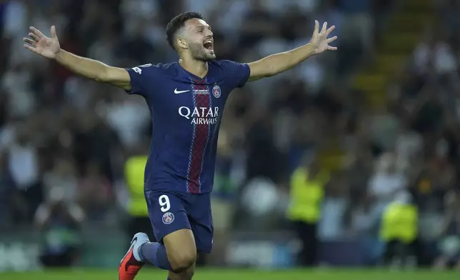 PSG's Goncalo Ramos celebrates after winning the UEFA Super Cup soccer match between Paris Saint-Germain and Tottenham Hotspur in Udine, Italy, Wednesday, Aug. 13, 2025. (AP Photo/Darko Bandic)