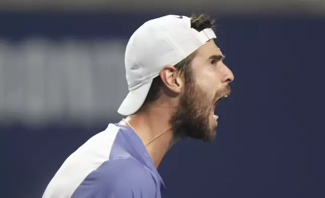 Karen Khachanov, of Russia, celebrates after winning the first set against Ben Shelton, of the United States, during the men's final at the National Bank Open tennis tournament in Toronto, Thursday, Aug. 7, 2025. (Chris Young/The Canadian Press via AP)