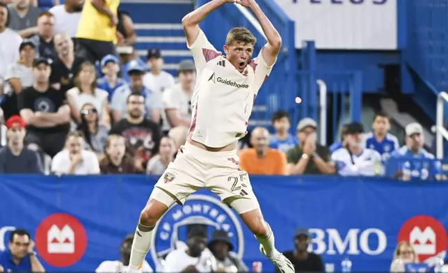 D.C. United's Jackson Hopkins (25) celebrates after scoring against CF Montreal during first-half MLS soccer match action in Montreal, Saturday, Aug. 16, 2025. (Graham Hughes/The Canadian Press via AP)