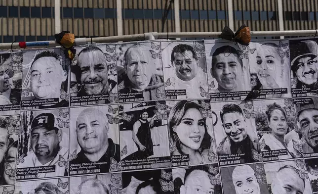 An art installation, which displays black and white images of people detained or deported as a result of ICE raids in Southern California, stands outside the federal building in Los Angeles, Thursday, July 17, 2025. (AP Photo/Jae C. Hong)