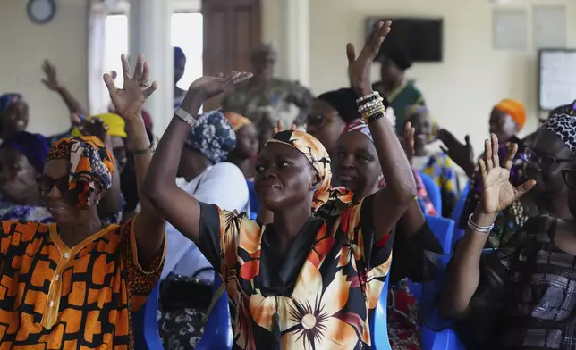 People use sign language during a church service at the Christian Mission for the Deaf in Lagos, Nigeria, Sunday, July 13, 2025. (AP Photo/Sunday Alamba)