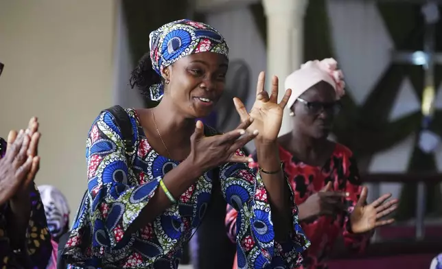 People interact using sign language during a church service at the Christian Mission for the Deaf in Lagos, Nigeria, Sunday, July 13, 2025. (AP Photo/Sunday Alamba)