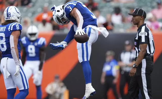 Indianapolis Colts wide receiver Coleman Owen (3) celebrates a touchdown catch during the second half of a preseason NFL football game against the Cincinnati Bengals, Saturday, Aug. 23, 2025, in Cincinnati. (AP Photo/Jeff Dean)