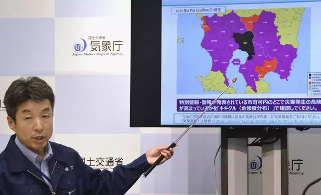 An official holds a press conference at the Japan Meteorological Agency in Tokyo Friday, Aug. 8, 2025. (Kyodo News via AP)