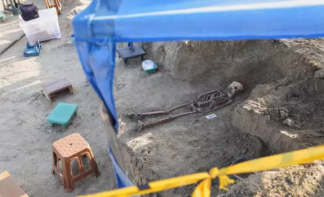 A number identifies a human skeleton exhumed from a mass grave in Chemmani, Sri Lanka, Aug. 5, 2025. (AP Photo/Eranga Jayawardena)