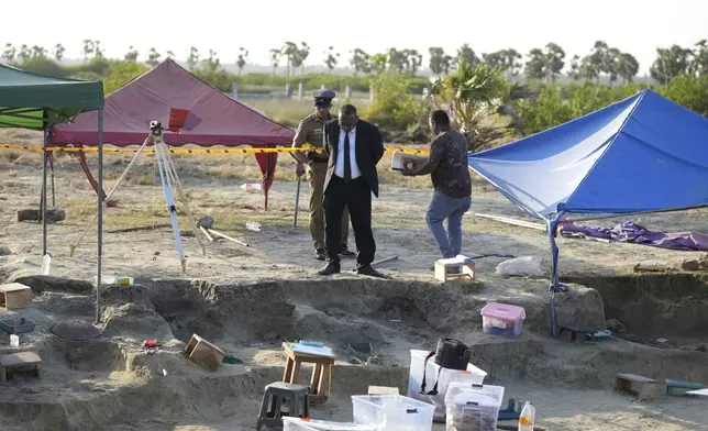 Magistrate Amalavalan Anandarajah, center, inspects a mass grave site in Chemmani, Sri Lanka, Aug. 5, 2025. (AP Photo/Eranga Jayawardena)