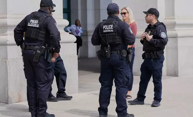 Members of the U.S. Customs and Border Protection Police patrol Union Station, Thursday, Aug. 28, 2025, in Washington. (AP Photo/Mariam Zuhaib)