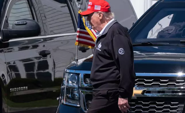 President Donald Trump walks at the Trump National Golf Club in Sterling, Va., Saturday, Aug. 30, 2025. (AP Photo/Manuel Balce Ceneta)