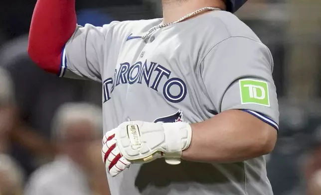 Toronto Blue Jays' Alejandro Kirk celebrates as he rounds the bases after hitting a two-run home run during the seventh inning of a baseball game against the Pittsburgh Pirates Tuesday, Aug. 19, 2025, in Pittsburgh. (AP Photo/Matt Freed)