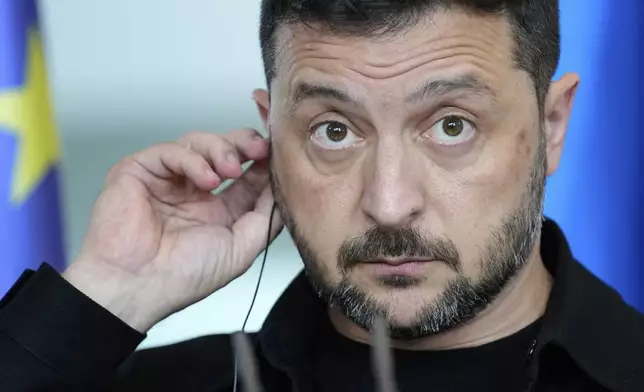 Ukrainian President Volodymyr Zelenskyy attends a joint press statement with German Chancellor Friedrich Merz following talks with European and U.S. leaders in Berlin, Germany, Wednesday, Aug. 13, 2025. (AP Photo/Ebrahim Noroozi)