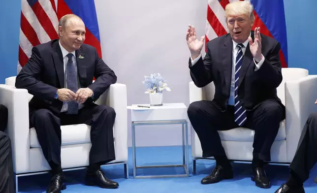 FILE - President Donald Trump speaks during a meeting with Russian President Vladimir Putin at the G20 Summit, July 7, 2017, in Hamburg. (AP Photo/Evan Vucci)
