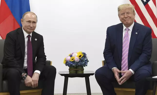FILE - President Donald Trump, right, meets with Russian President Vladimir Putin on the sidelines of the G-20 summit in Osaka, Japan, June 28, 2019. (AP Photo/Susan Walsh, File)