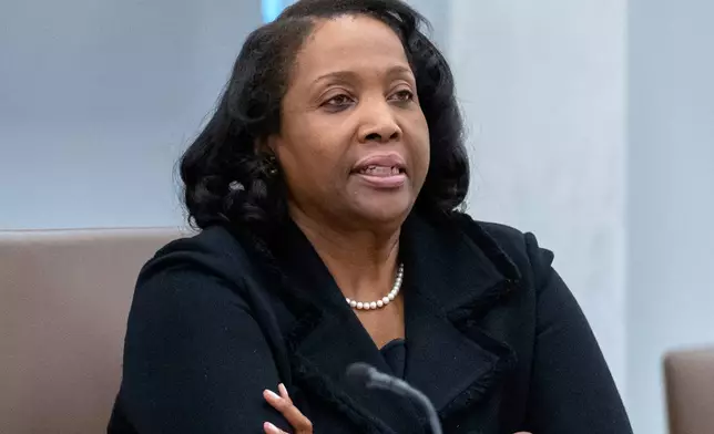 FILE - Federal Reserve Board of Governors member Lisa Cook listens during an open meeting of the Board of Governors at the Federal Reserve, June 25, 2025, in Washington. (AP Photo/Mark Schiefelbein, File)