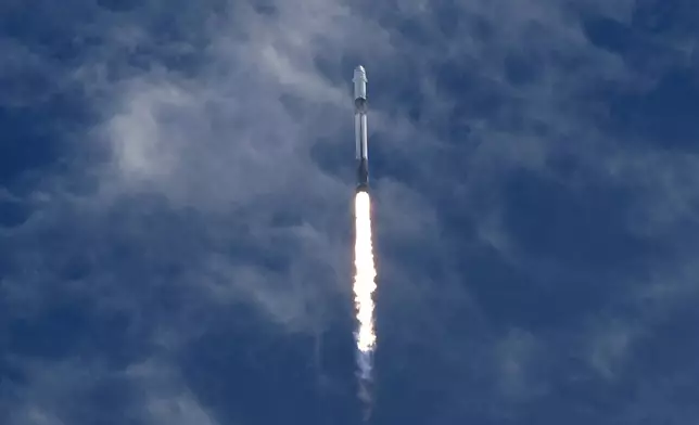A SpaceX Falcon 9 rocket, carrying a Dragon capsule with a U.S.-Japanese-Russian crew of four, lifts off from Kennedy Space Center's Launch Pad 39-A in Cape Canaveral , Fla., on Friday, Aug. 1, 2025. (AP Photo/Chris O'Meara)
