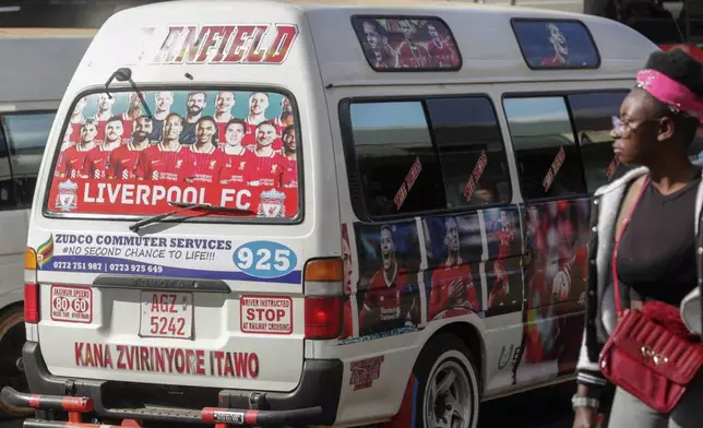 A minibus taxi branded with the Liverpool Football Club players drives along a street, in Harare, Zimbabwe, Sunday, Aug. 10, 2025. (AP Photo/Aaron Ufumeli)