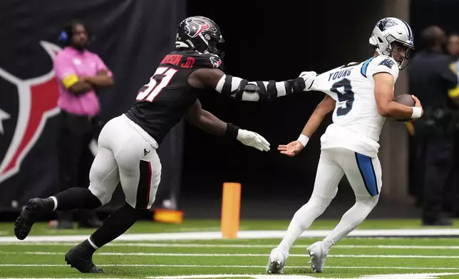 Carolina Panthers quarterback Bryce Young is tackled by Houston Texans defensive end Will Anderson Jr. during the first half of an NFL preseason football game on Saturday, Aug. 16, 2025, in Houston. (AP Photo/Ashley Landis)