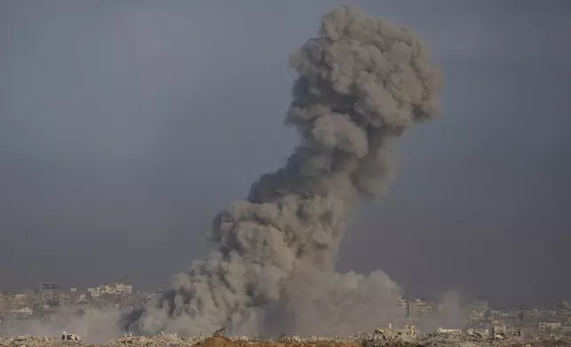 Smoke rises to the sky following an Israeli military strike in the Gaza Strip as seen from southern Israel, Thursday, Aug. 28, 2025. (AP Photo/Maya Levin)