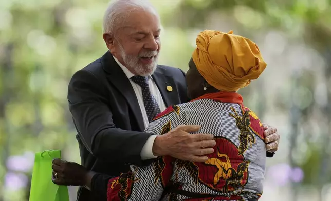 Brazil President Luiz Inacio Lula da Silva embraces Virgelina Chara, an Afro-Colombian leader and human rights activist, during a meeting of leaders of the Amazon Cooperation Treaty Organization in Bogota, Colombia, Friday, Aug. 22, 2025. (AP Photo/Fernando Vergara)