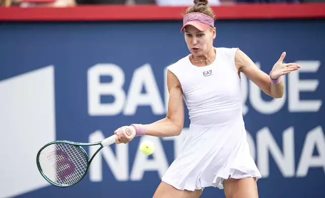 Veronika Kudermetova returns a shot during third-round match action against Coco Gauff, of the United States, at the National Bank Open women's tennis tournament in Montreal, Thursday, July 31, 2025. (Christopher Katsarov/The Canadian Press via AP)