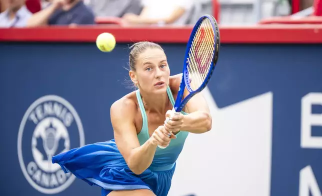 Marta Kostyuk, of Ukraine, hits a return against Daria Kasatkina, of Australia, during the National Bank Open women’s tennis tournament, Thursday, July 31, 2025, in Montreal. (Christopher Katsarov/The Canadian Press via AP)