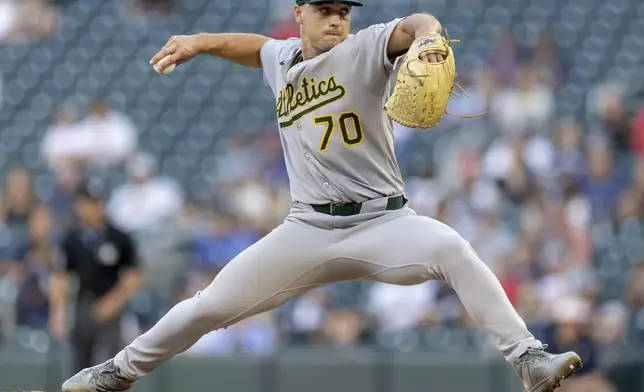 Athletics pitcher J.T. Ginn (70) winds up for a pitch against the Minnesota Twins during the third inning of a baseball game at Target Field in Minneapolis, Wednesday, Aug. 20, 2025. (Carlos Gonzalez/Star Tribune via AP)