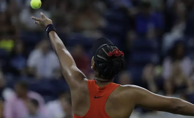 Naomi Osaka, of Japan, serves to Greet Minnen, of Belgium, during the first round of the U.S. Open tennis championships, Tuesday, Aug. 26, 2025, in New York. (AP Photo/Adam Hunger)