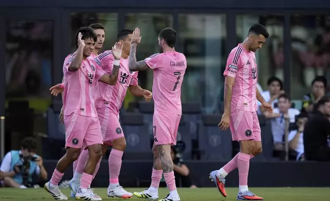 Inter Miami midfielder Telasco Segovia (8), left, celebrates with teammates after scoring his side's first goal during the first half of a Leagues Cup soccer match against Necaxa, Saturday, Aug. 2, 2025, in Fort Lauderdale, Fla. (AP Photo/Rebecca Blackwell)