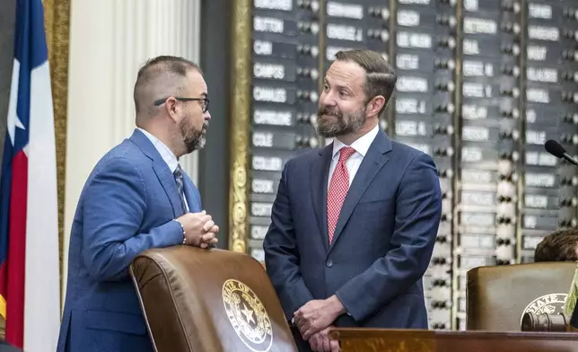 CORRECTS LAST NAME Texas House Speaker Dustin Burrows, R-Lubbock, right, and House Rep. Joe Moody, D-El Paso, meet at the speaker's diocese after a second special session began Friday, Aug. 15, 2025, in Austin, Texas. (AP Photo/Rodolfo Gonzalez)