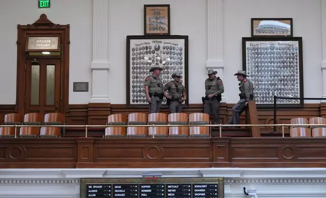 Texas Troopers gather in the gallery of the House Chamber at the Texas Capitol after a second special session was gaveled in, Monday, Aug. 18, 2025, in Austin, Texas. (AP Photo/Eric Gay)