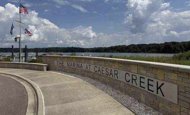 Flags fly at Caesar Creek Marina at Caesar Creek State Park in Waynesville, Ohio, Thursday, Aug. 7, 2025. (AP Photo/Patrick Aftoora-Orsagos)