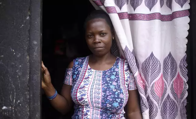 Alice Nekesa, 28, a mother of one who contracted malaria during her second pregnancy, poses for a photo in her home in Kampala, Uganda, Sunday, Aug. 17, 2025. (AP Photo/Patrick Onen)