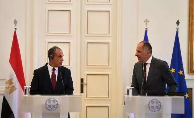 Egyptian Foreign Minister Badr Abdelatty, left, and his Greek counterpart George Gerapetritis speak to the reporters after their meeting in Athens, Greece, Wednesday, Aug. 6, 2025. (AP Photo/Thanassis Stavrakis)