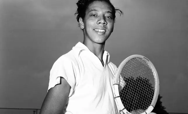 FILE - Tennis player Althea Gibson, of Sumter, South Carolina, is shown before a practice session at the West Side Tennis Club at Forest Hills, Queens, New York, July 29, 1950. (AP Photo/John Lent,File)