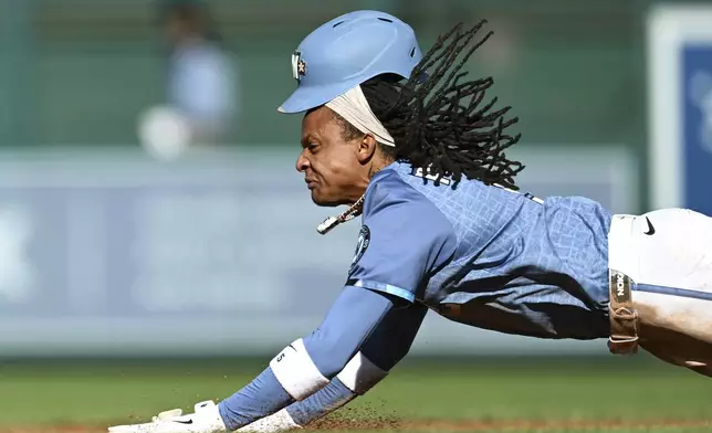 Washington Nationals' CJ Abrams slides into second base for a stolen base during the third inning of a baseball game against the Tampa Bay Rays, Saturday, Aug. 30, 2025, in Washington. (AP Photo/Terrance Williams)
