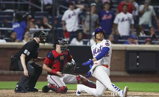 New York Mets' Juan Soto strikes out swinging to end the fifth inning of a baseball game against the Atlanta Braves, Wednesday, Aug. 13, 2025, in New York. (AP Photo/Heather Khalifa)