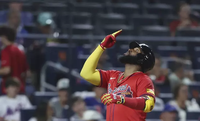 Atlanta Braves' Marcell Ozuna gestures after a home run during the sixth inning of a baseball game against the New York Mets, Wednesday, Aug. 13, 2025, in New York. (AP Photo/Heather Khalifa)