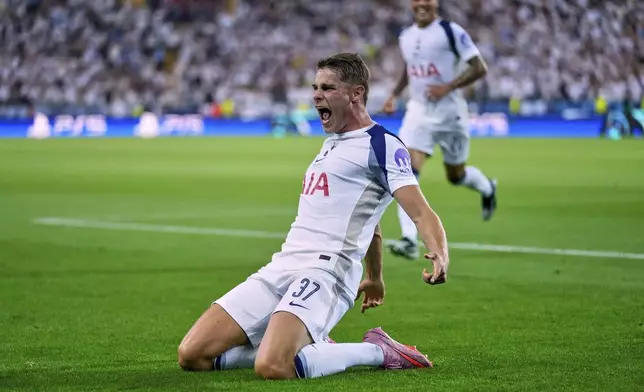 Tottenham's Micky van de Ven celebrates after scoring during the UEFA Super Cup soccer match between Paris Saint-Germain and Tottenham Hotspur in Udine, Italy, Wednesday, Aug. 13, 2025. (AP Photo/Darko Bandic)
