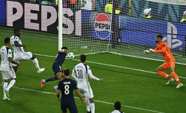 PSG's Goncalo Ramos scores his side's second goal during the UEFA Super Cup soccer match between Paris Saint-Germain and Tottenham Hotspur in Udine, Italy, Wednesday, Aug. 13, 2025. (AP Photo/Denes Erdos)