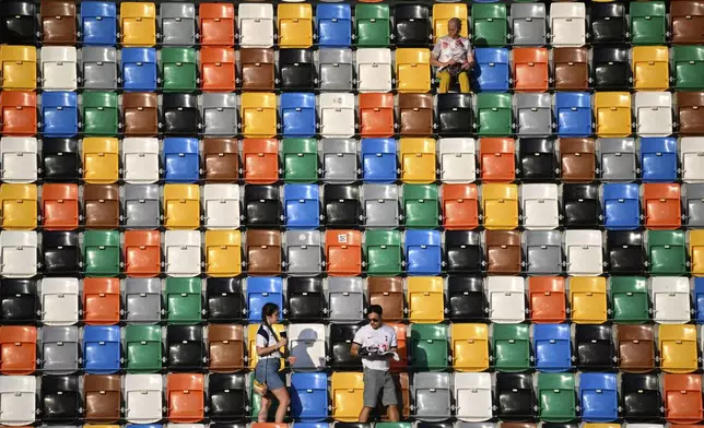 Spectators take their places before the UEFA Super Cup soccer match between Paris Saint-Germain and Tottenham Hotspur in Udine, Italy, Wednesday, Aug. 13, 2025. (AP Photo/Denes Erdos)
