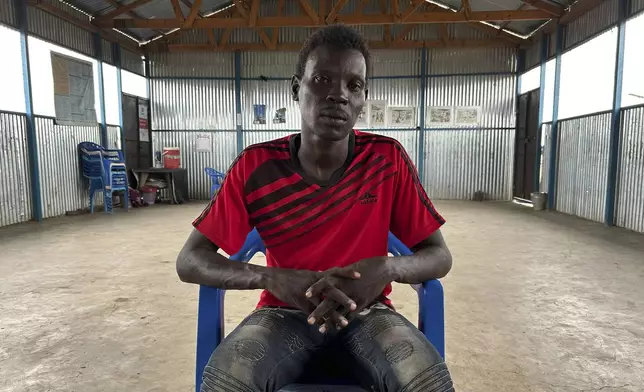 Simon Tong, 39 years-old, who says he was arrested by the Sudanese Armed Forces and tortured during his confinement, poses for a photo during an interview with The Associated Press in Renk, South Sudan, Wednesday, Aug 6, 2025. (AP Photo/Adlai Coleman)