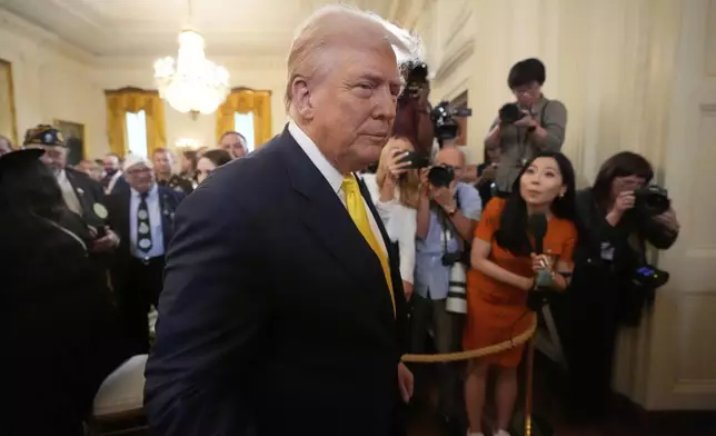 President Donald Trump departs an event to mark National Purple Heart Day in the East Room of the White House, Thursday, Aug. 7, 2025, in Washington. (AP Photo/Mark Schiefelbein)