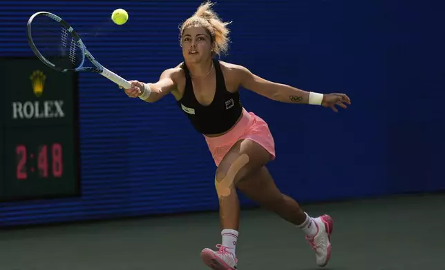 Renata Zarazua, of Mexico, returns a shot to Madison Keys, of the United States, during the first round of the US Open tennis championships, Monday, Aug. 25, 2025, in New York. (AP Photo/Seth Wenig)