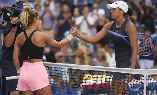 Renata Zarazua, of Mexico, left, shakes hands with Madison Keys, of the United States, after defeating Keys during the first round of the US Open tennis championships, Monday, Aug. 25, 2025, in New York. (AP Photo/Seth Wenig)