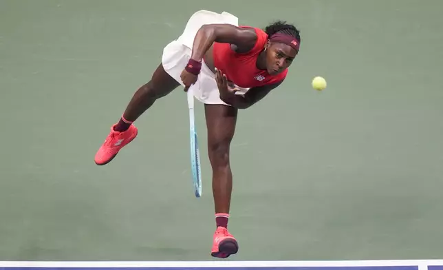 Coco Gauff, of the United States, serves to Ajla Tomljanovic, of Australia, during the first round of the U.S. Open tennis championships, Tuesday, Aug. 26, 2025, in New York. (AP Photo/Frank Franklin II)