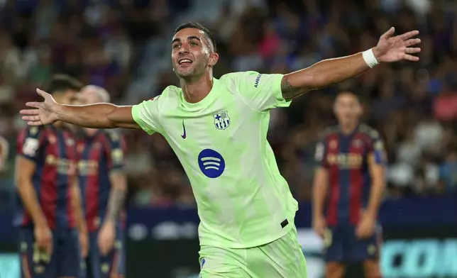 Barcelona's Ferran Torres reacts after scoring during the La Liga soccer match between Levante and Barcelon in Valencia, Spain, Saturday, Aug. 23, 2025. ((AP Photo/Alberto Saiz)